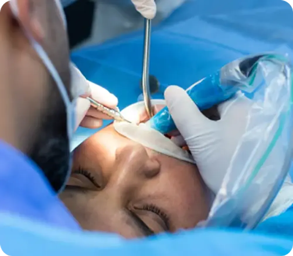 Dentist performing a tooth extraction on a female patient in a modern dental clinic.