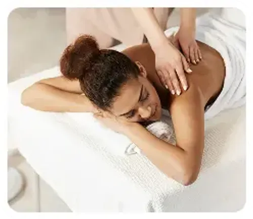 A female spa guest receiving a professional back masssage