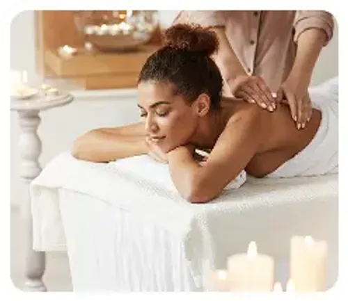 A realxed woman lying on a massage table during a spa treatment